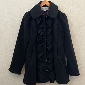 Black wool coat with ruffles. Women size medium. Only worn once. Fun & cute.